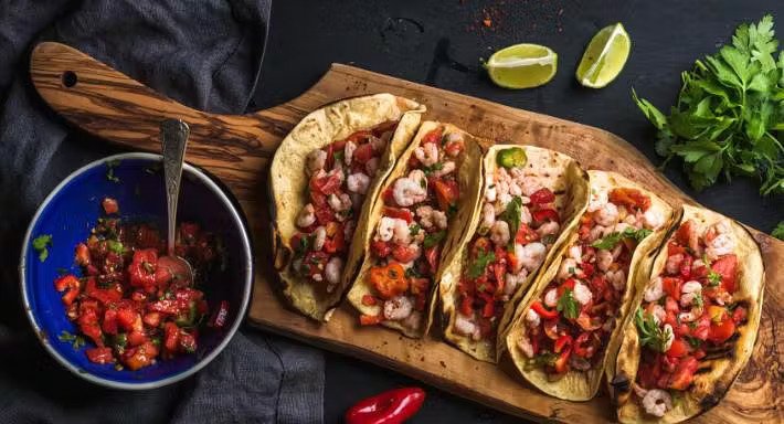 Authentic Mexican tacos with salsa and coriander